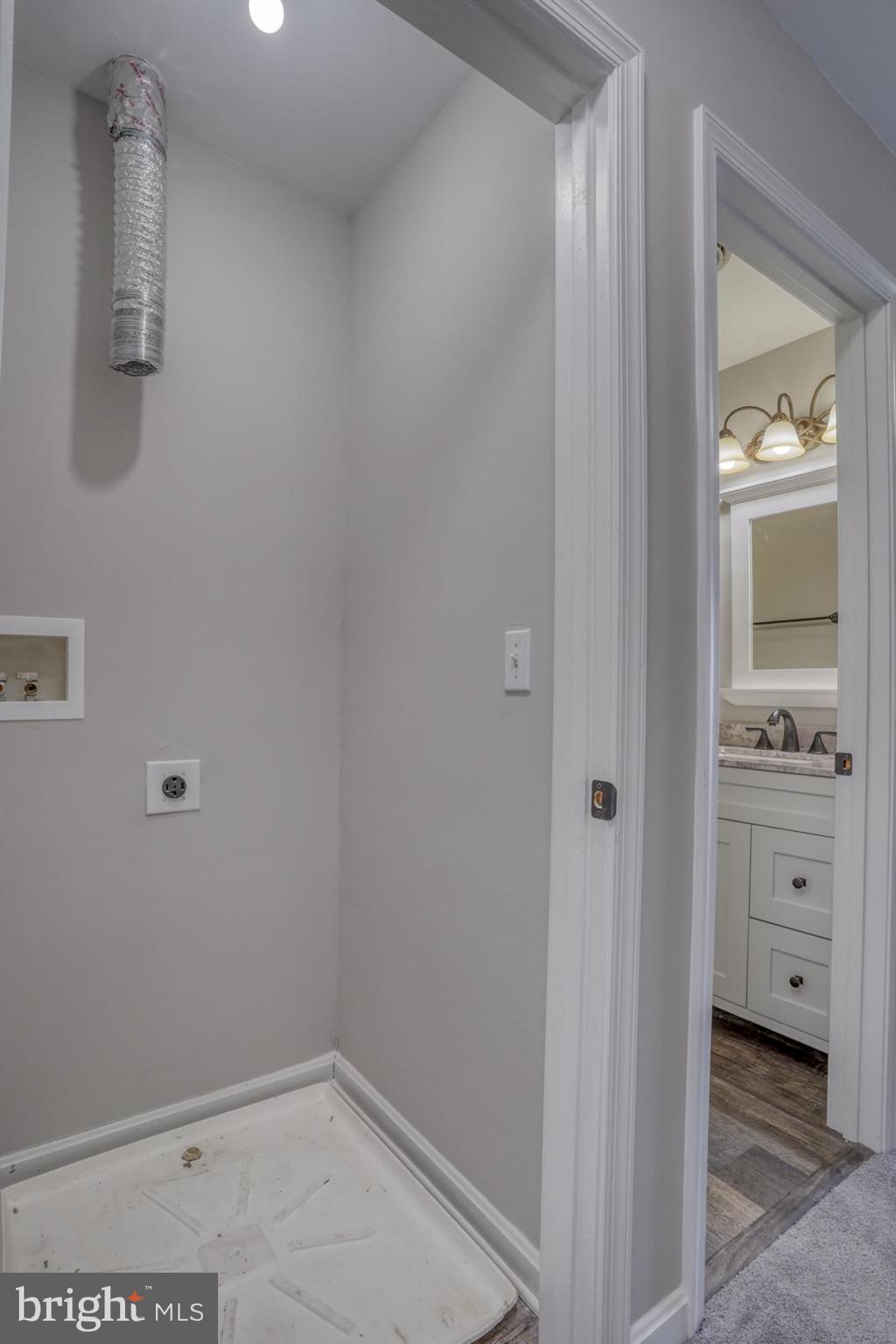 39 High Street Kenton, DE 19955 - Photo 24 of 49 a view of bathroom with a sink a mirror and a window