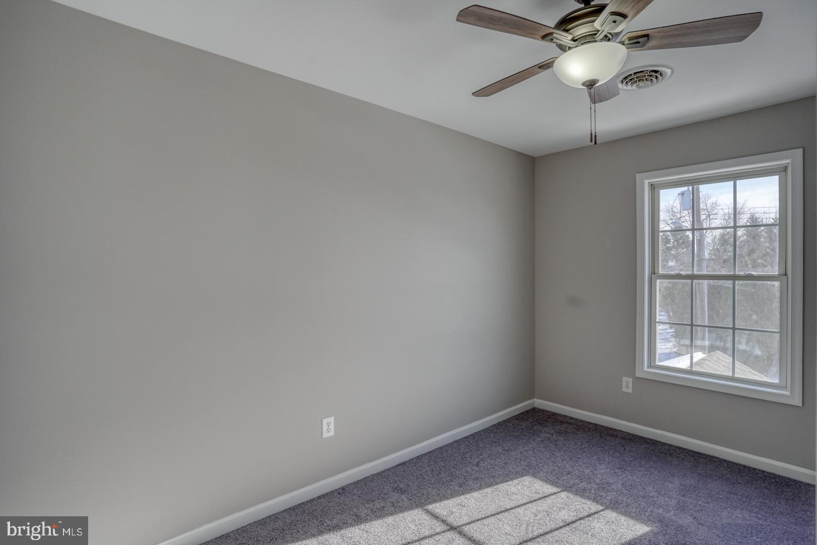 39 High Street Kenton, DE 19955 - Photo 27 of 49 an empty room with a window and a fan