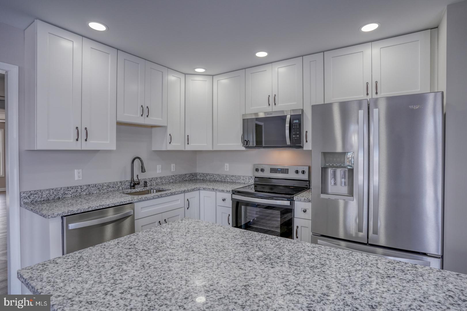39 High Street Kenton, DE 19955 - Photo 30 of 49 a kitchen with stainless steel appliances granite countertop a refrigerator a stove a sink and a microwave