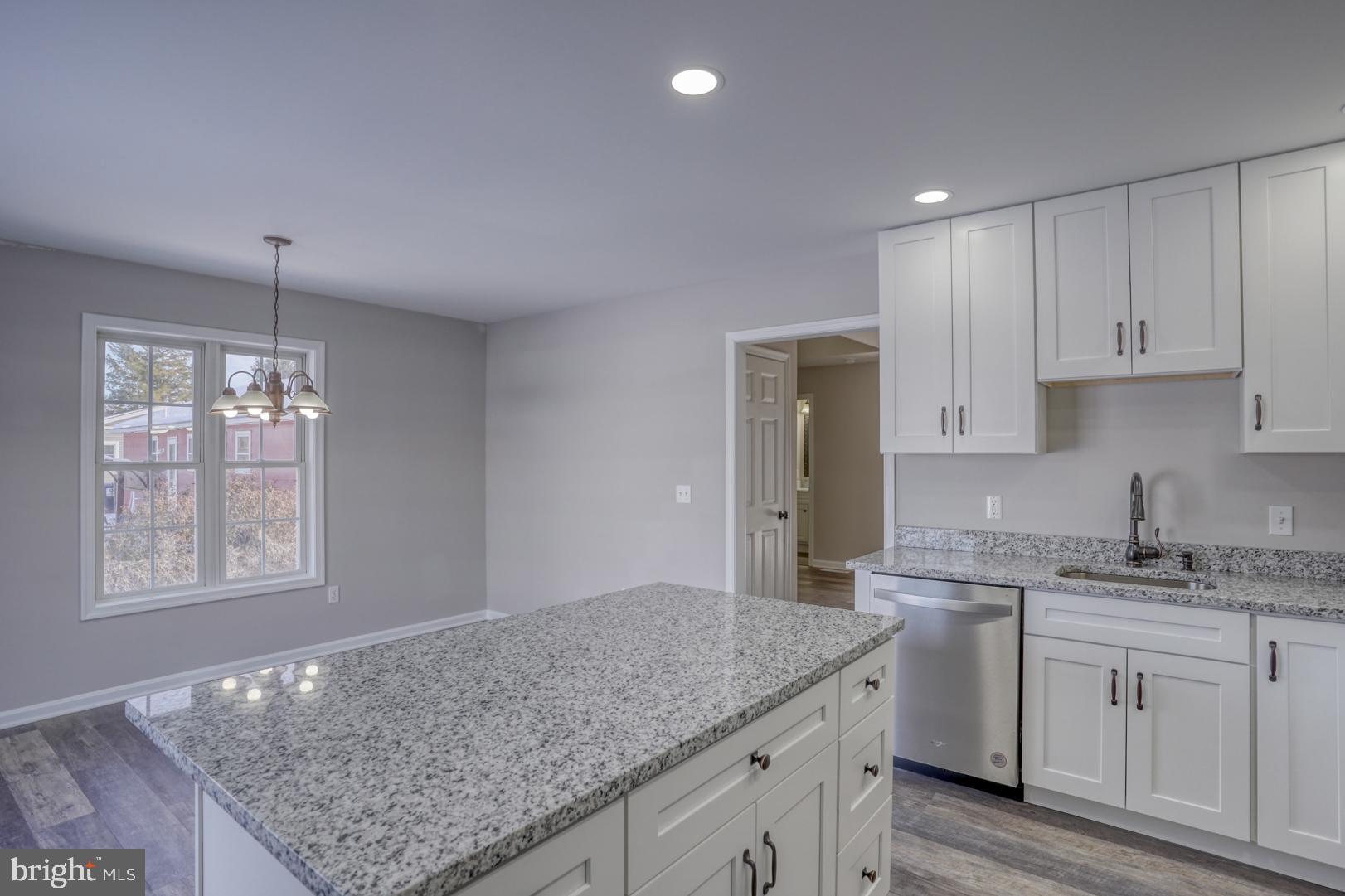 39 High Street Kenton, DE 19955 - Photo 34 of 49 a kitchen with stainless steel appliances granite countertop a sink stove and cabinets