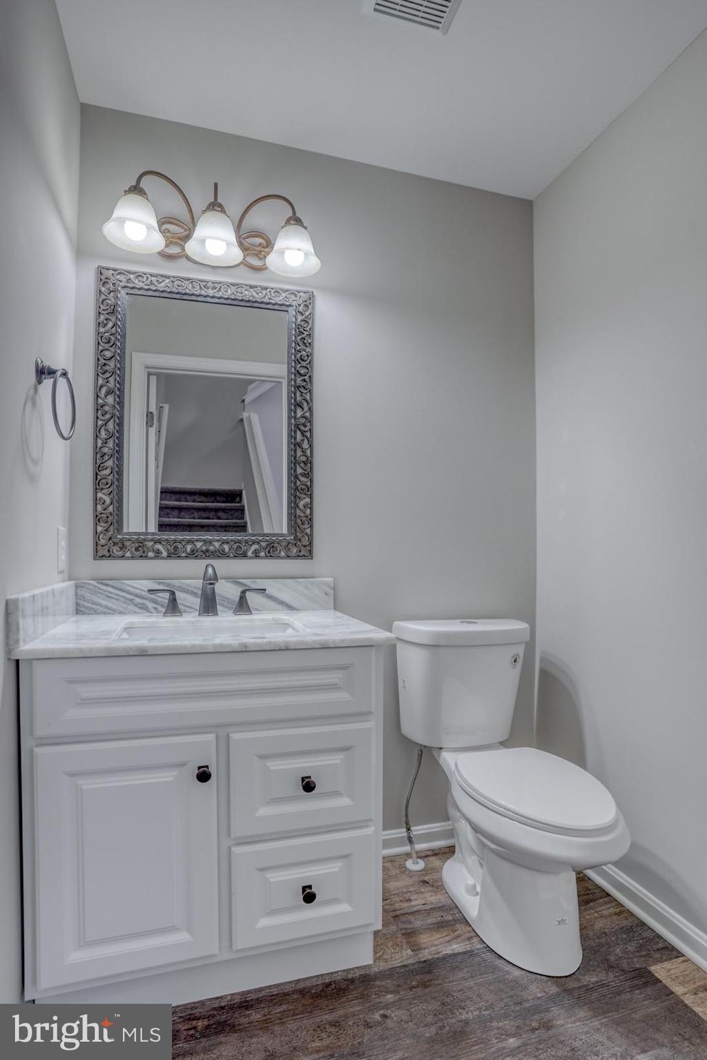 39 High Street Kenton, DE 19955 - Photo 36 of 49 a bathroom with a toilet sink and mirror