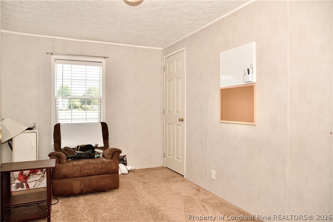 1071 Watts Road Lumberton, NC 28360 - Photo 25 of 31 a living room with furniture and a window
