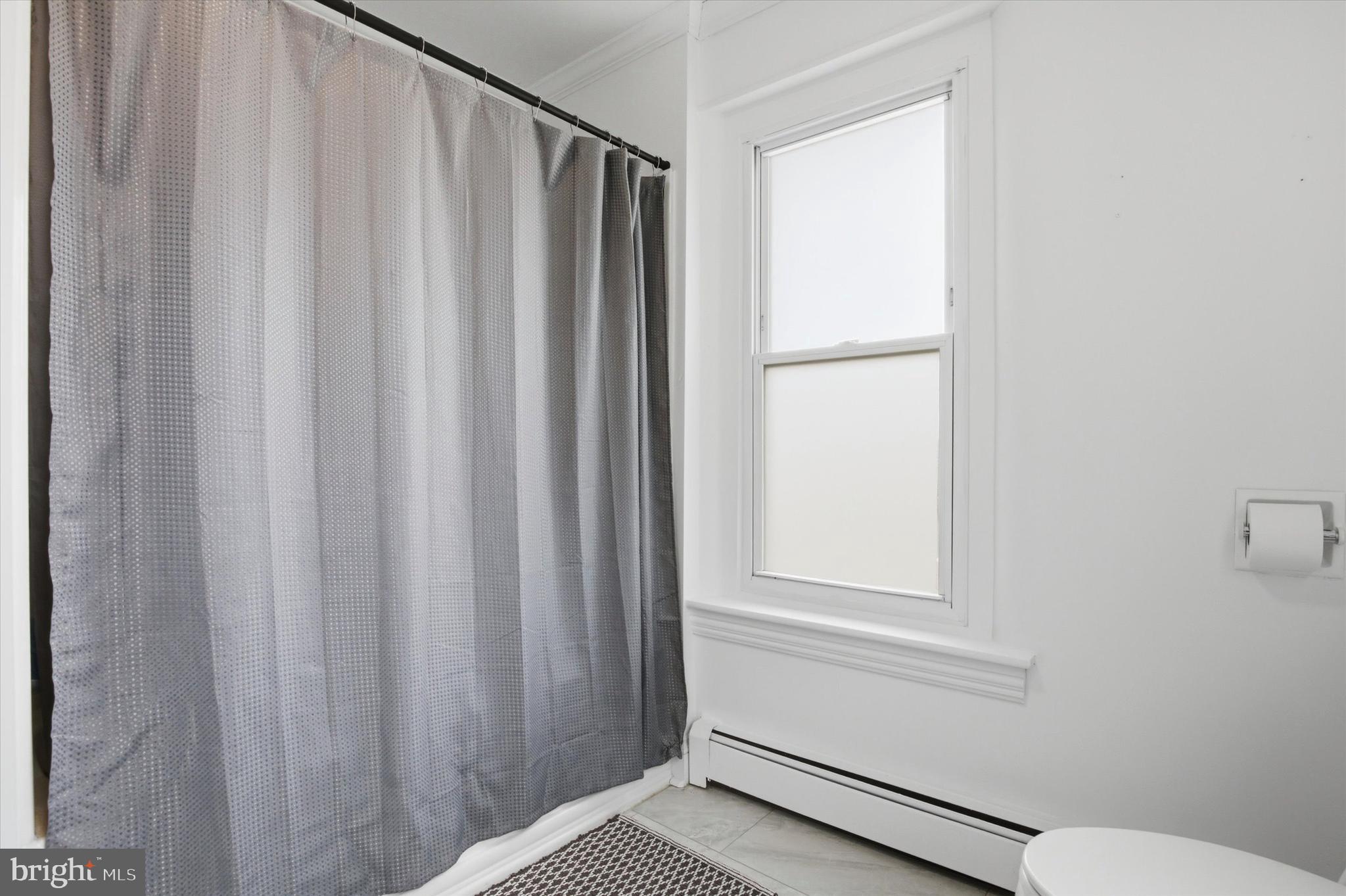 429 Main Street Green Lane, PA 18054 - Photo 14 of 25 a bathroom with a window and a shower