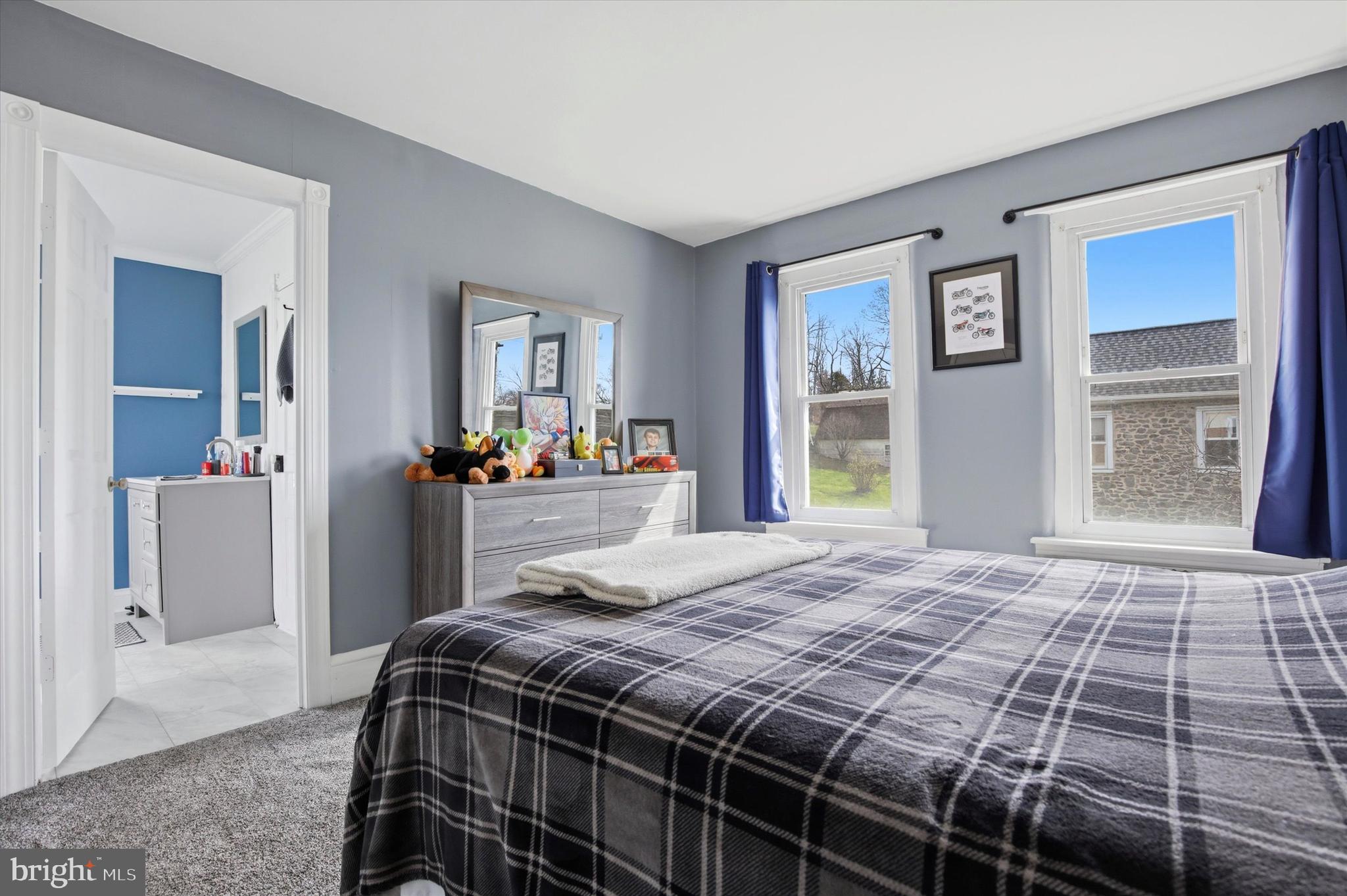 429 Main Street Green Lane, PA 18054 - Photo 10 of 25 a bedroom with a large bed and a window