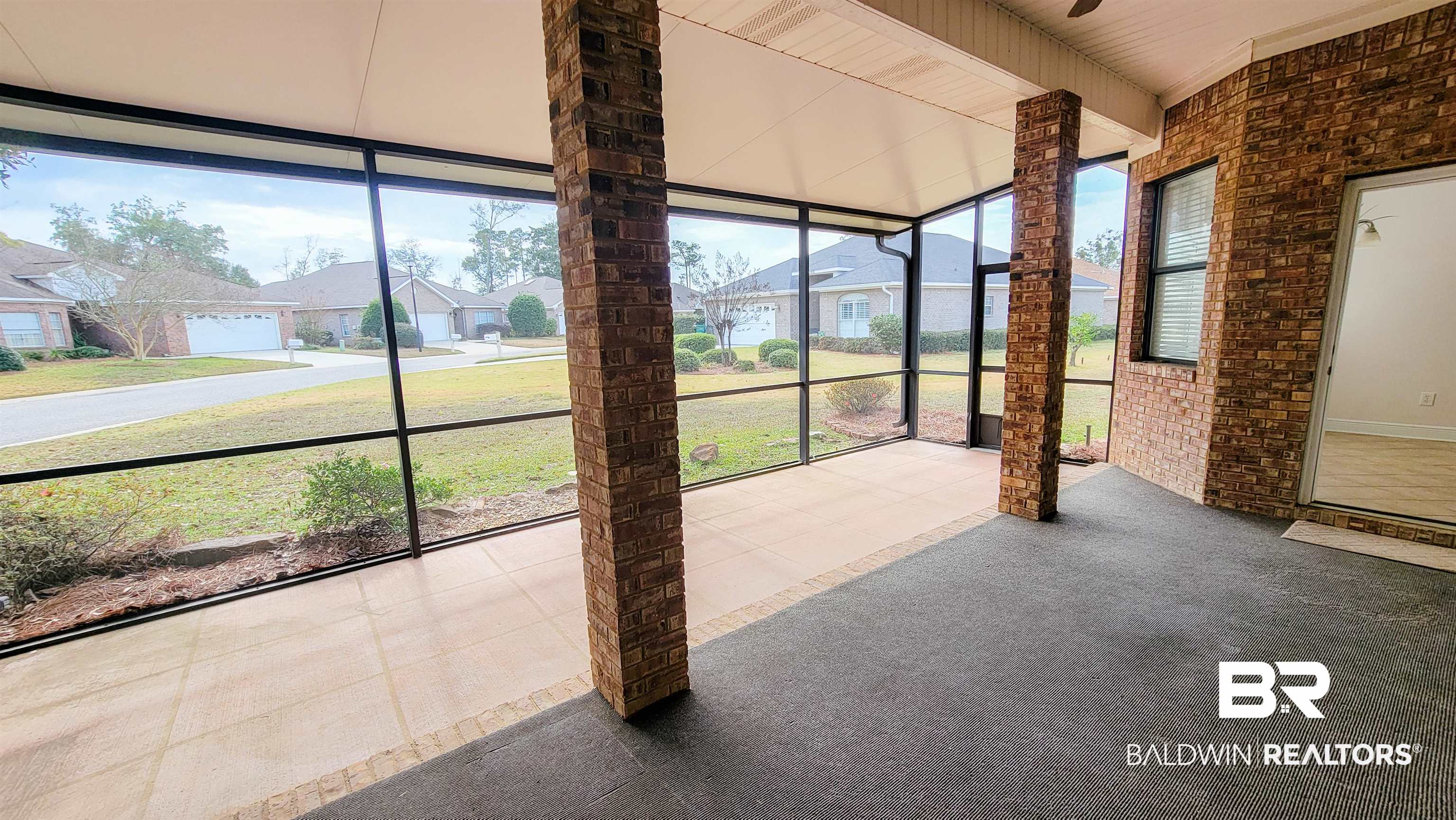 214 Hemingway Loop Foley, AL 36535 - Photo 33 of 67 Unfurnished sunroom featuring healthy amount of natural light and a residential view