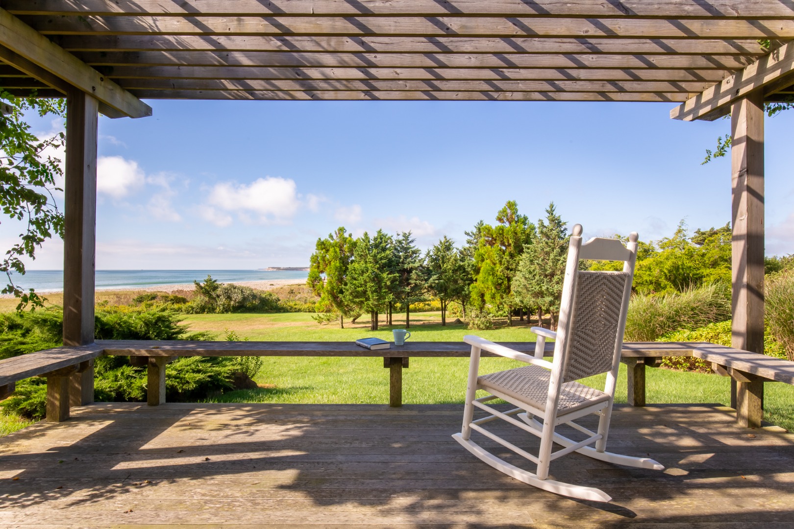 95 Stonewall Road Chilmark, MA 02535 - Photo 13 of 51 a view of a ocean with a floor to ceiling windows and a yard