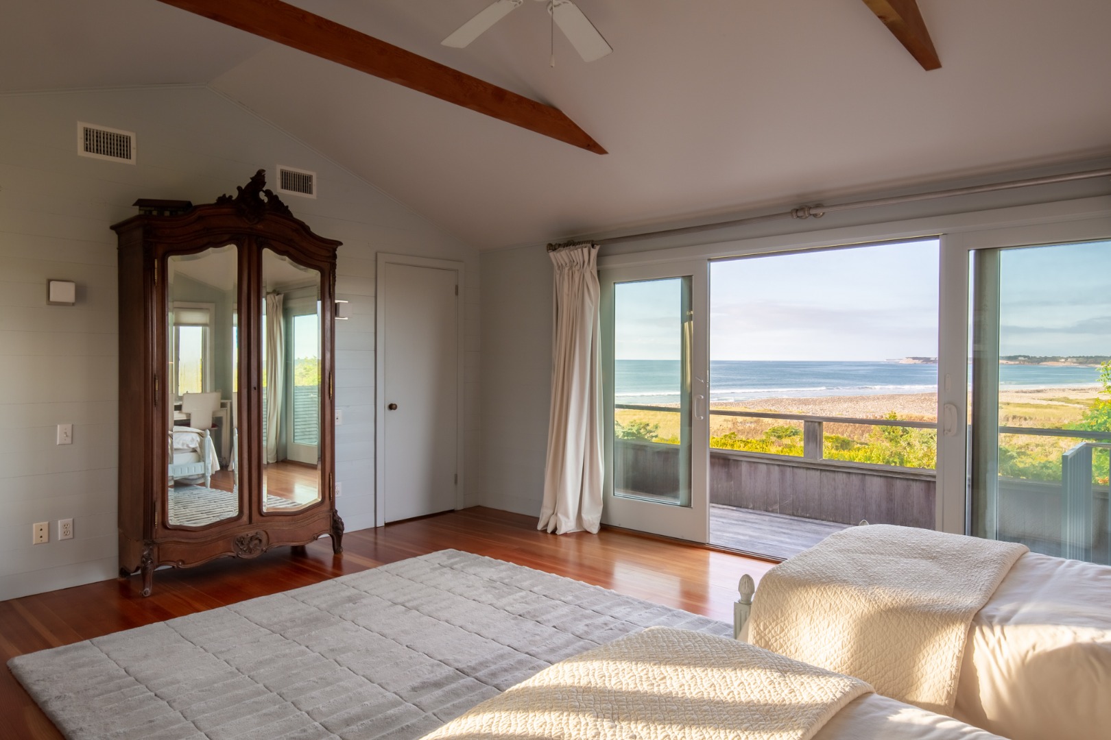 95 Stonewall Road Chilmark, MA 02535 - Photo 19 of 51 a bedroom with a large bed and a large window