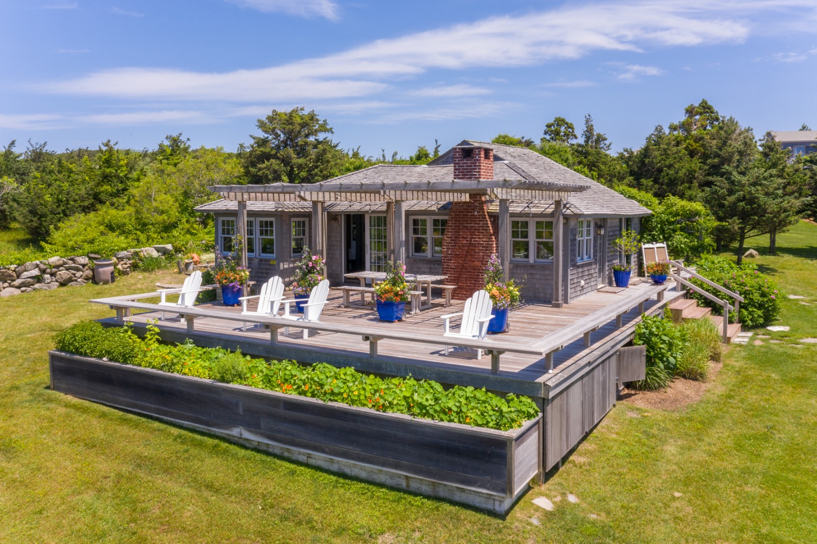 95 Stonewall Road Chilmark, MA 02535 - Photo 23 of 51 a view of a swimming pool and lounge chair