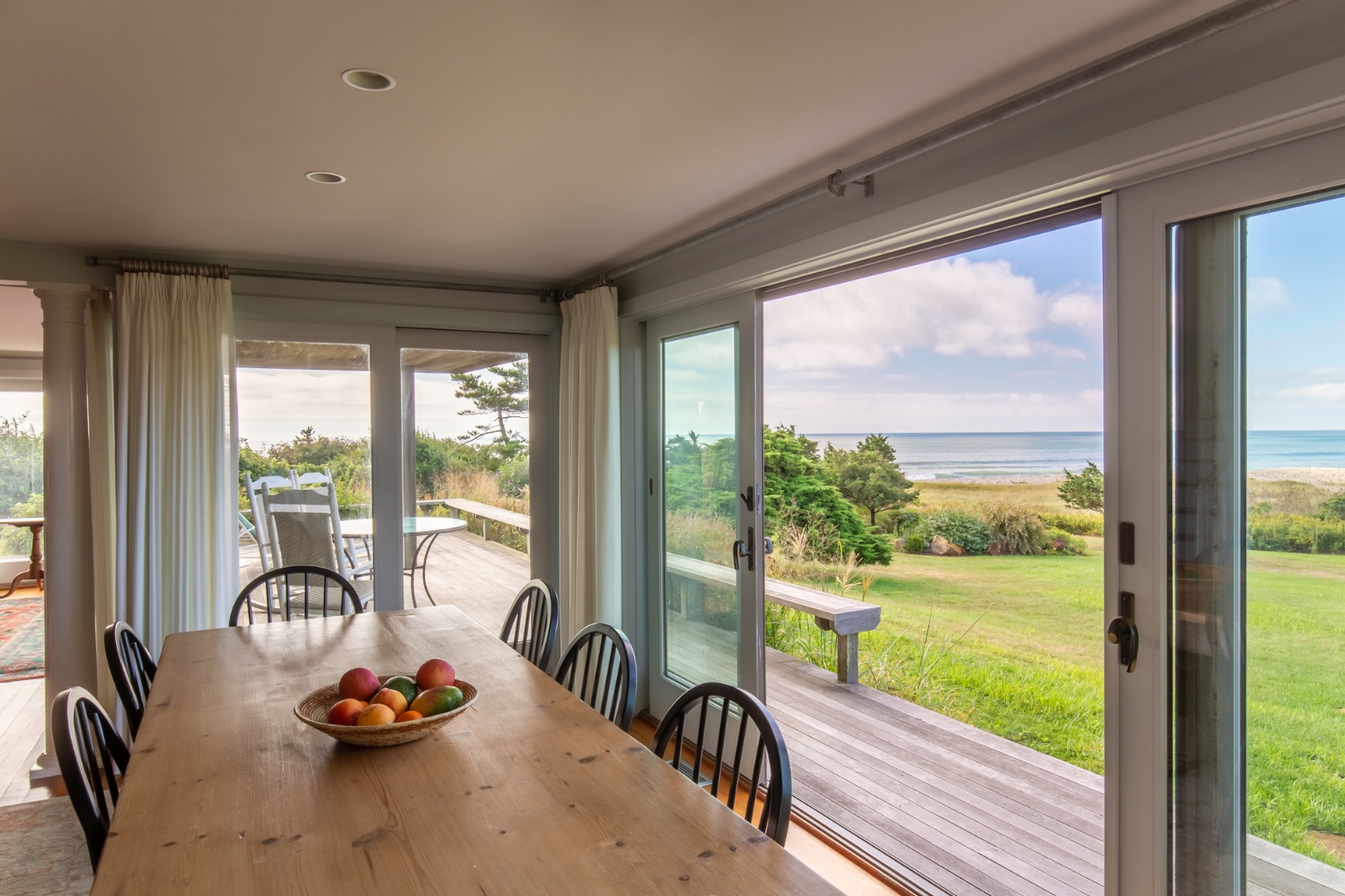 95 Stonewall Road Chilmark, MA 02535 - Photo 6 of 51 a view of a room with large windows and furniture