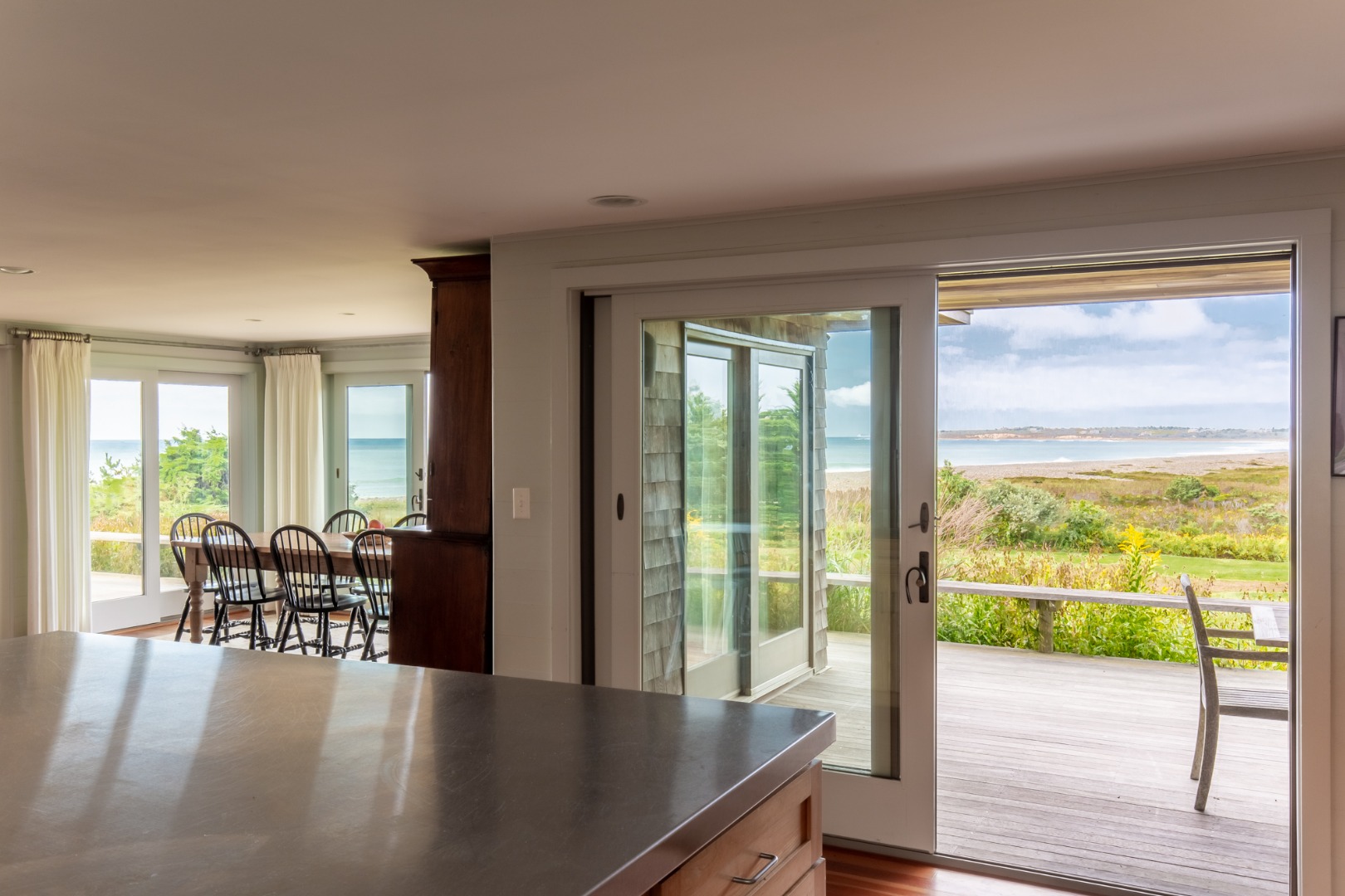 95 Stonewall Road Chilmark, MA 02535 - Photo 8 of 51 a view of a livingroom with furniture and floor to ceiling window