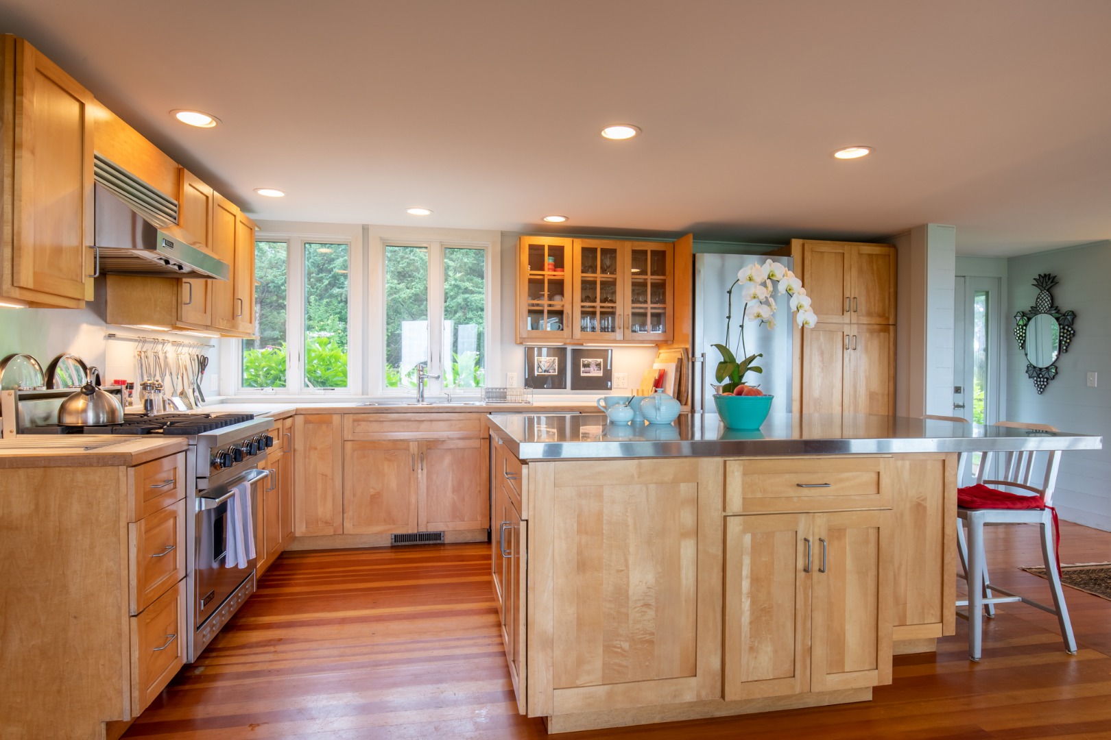95 Stonewall Road Chilmark, MA 02535 - Photo 9 of 51 a kitchen with stainless steel appliances granite countertop a stove and a wooden floors