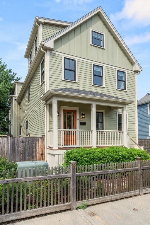 a front view of a house with a fence