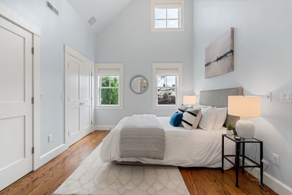 8 Clyde Street Somerville, MA 02145 - Photo 11 of 22 a bedroom with a bed and window
