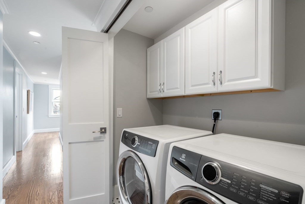 8 Clyde Street Somerville, MA 02145 - Photo 17 of 22 a utility room with dryer and washer