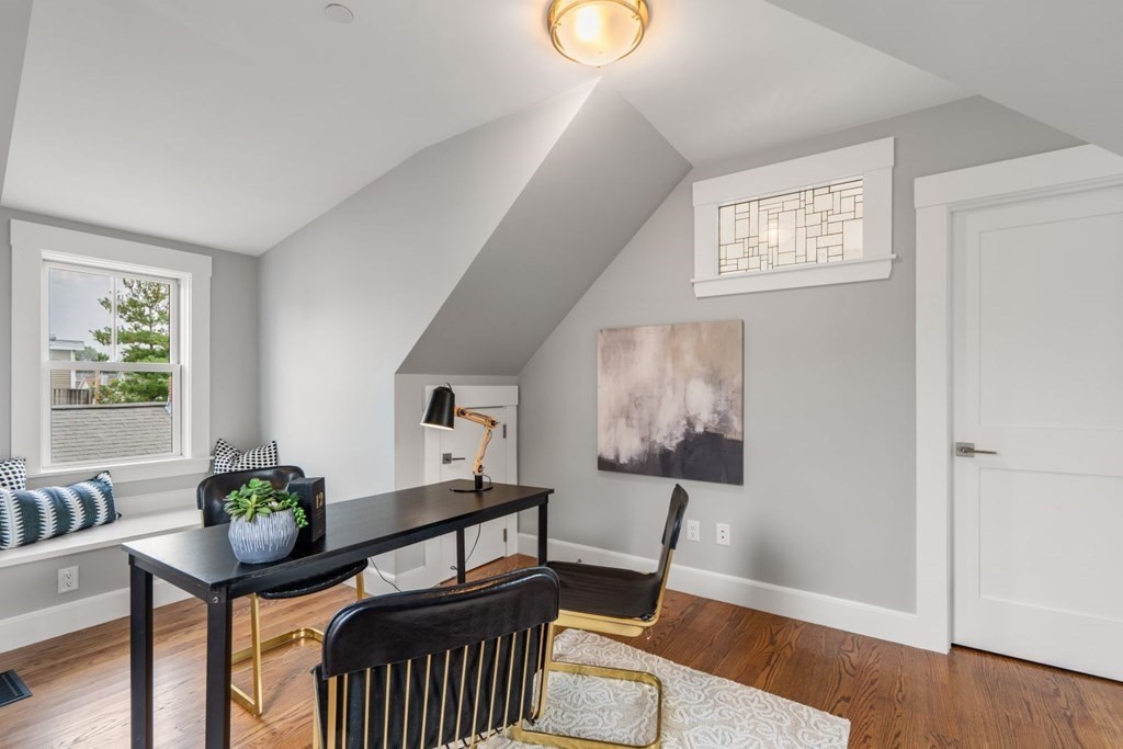 8 Clyde Street Somerville, MA 02145 - Photo 18 of 22 a view of a livingroom with furniture and wooden floor