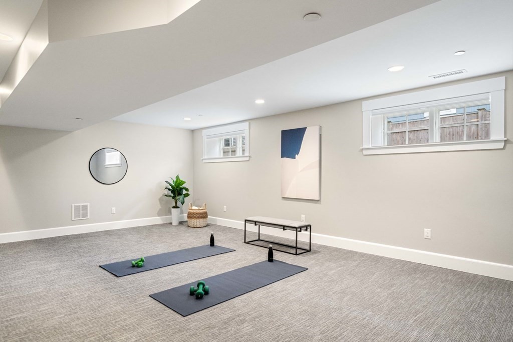 8 Clyde Street Somerville, MA 02145 - Photo 21 of 22 a living room with furniture and a window