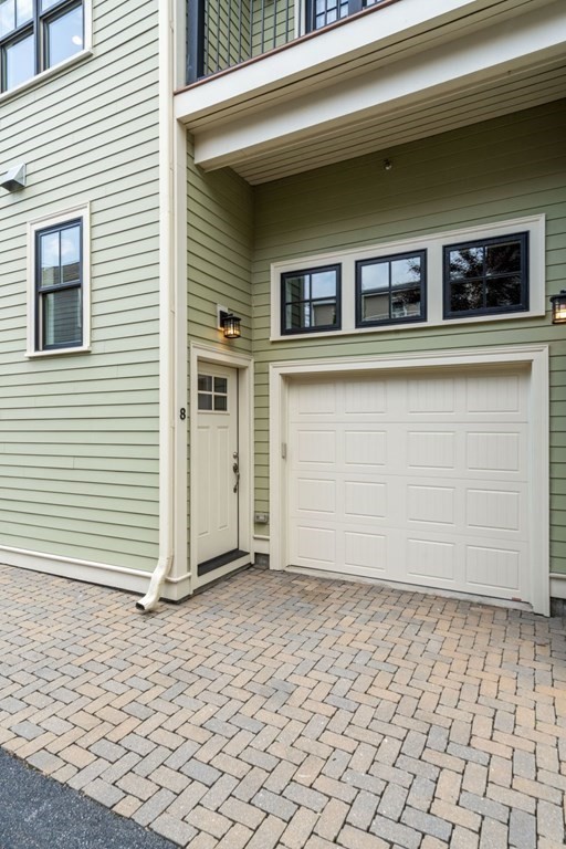 8 Clyde Street Somerville, MA 02145 - Photo 22 of 22 a view of a house with parking space