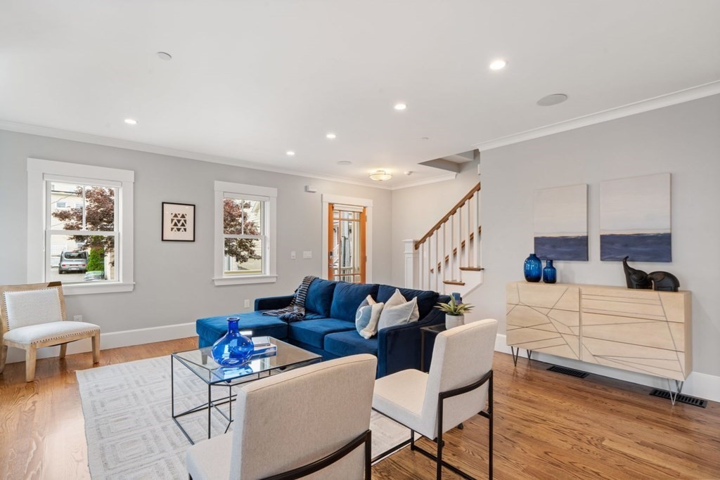 8 Clyde Street Somerville, MA 02145 - Photo 4 of 22 a living room with furniture and wooden floor