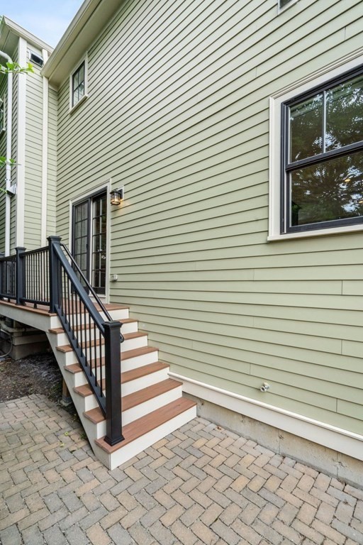 8 Clyde Street Somerville, MA 02145 - Photo 10 of 22 a view of a house with large windows