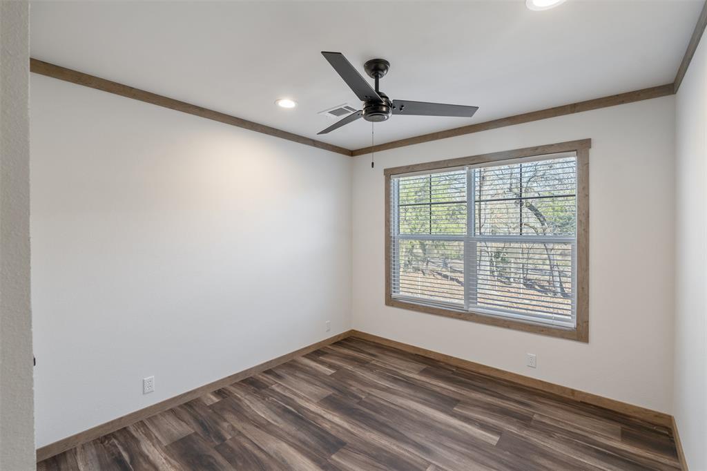 9603 County Road 2138 Kemp, TX 75143 - Photo 24 of 36 a view of an empty room with a window