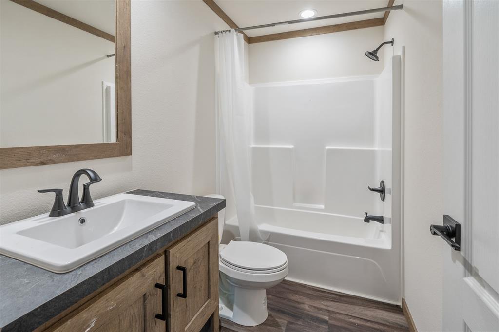 9603 County Road 2138 Kemp, TX 75143 - Photo 25 of 36 a bathroom with a sink toilet and shower