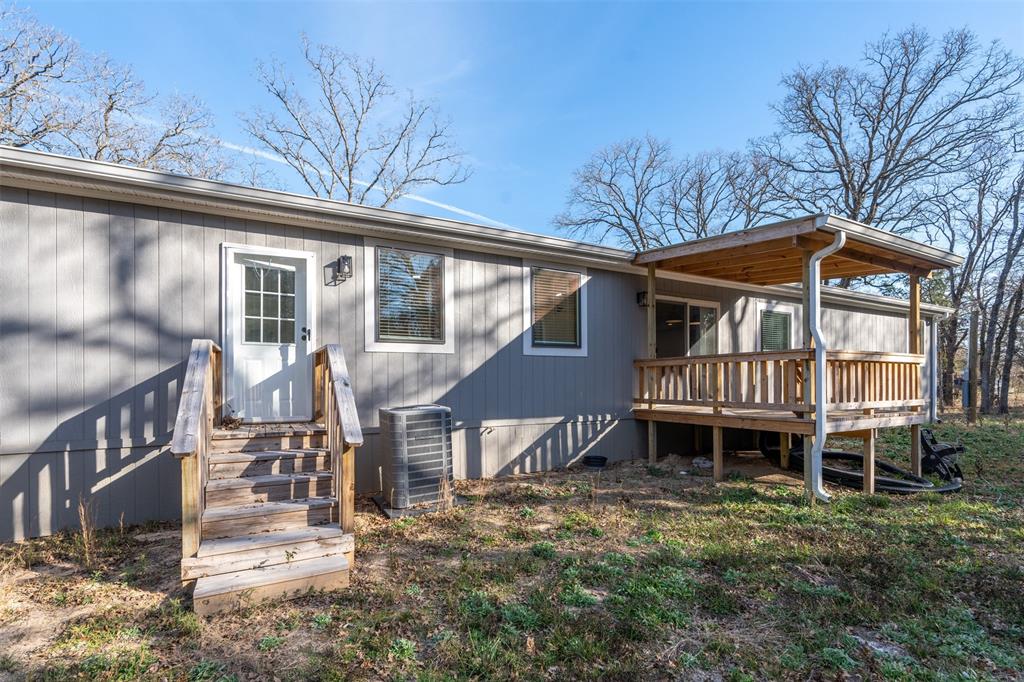 9603 County Road 2138 Kemp, TX 75143 - Photo 30 of 36 a front view of a house with a yard