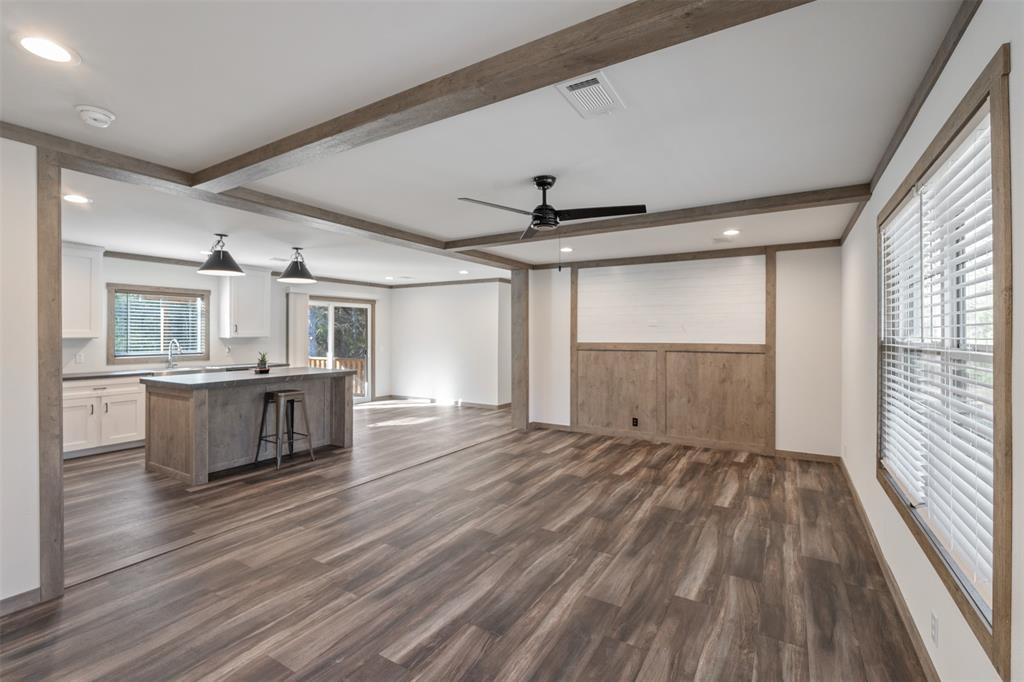 9603 County Road 2138 Kemp, TX 75143 - Photo 7 of 36 a view of an empty room with wooden floor and a window
