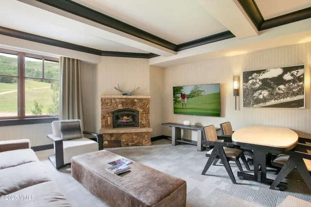 a living room with furniture a window and a fireplace