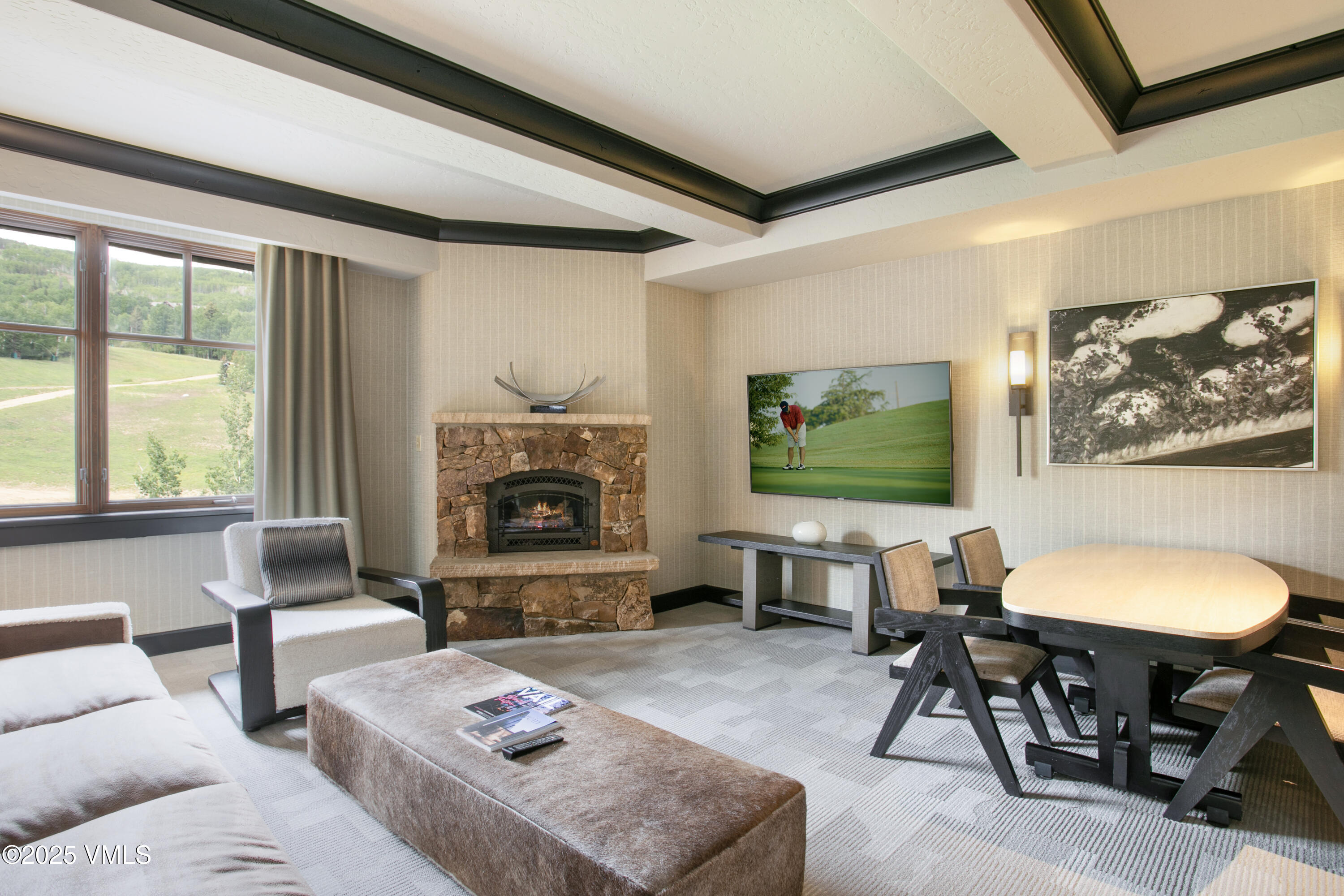 a living room with furniture a window and a fireplace