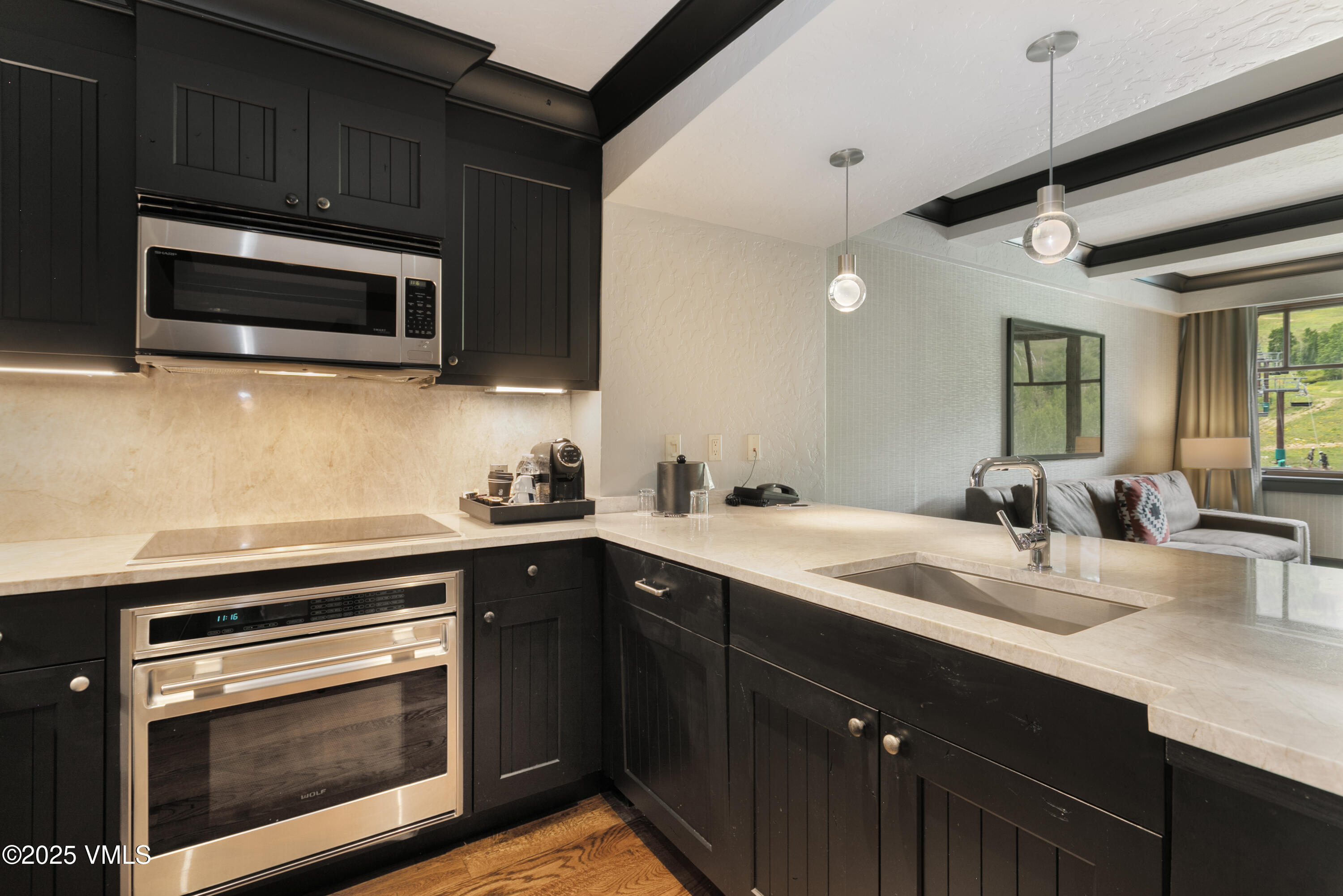 130 Daybreak Ridge Road, Unit 732 Avon, CO 81620 - Photo 11 of 17 a kitchen with a sink stove and microwave