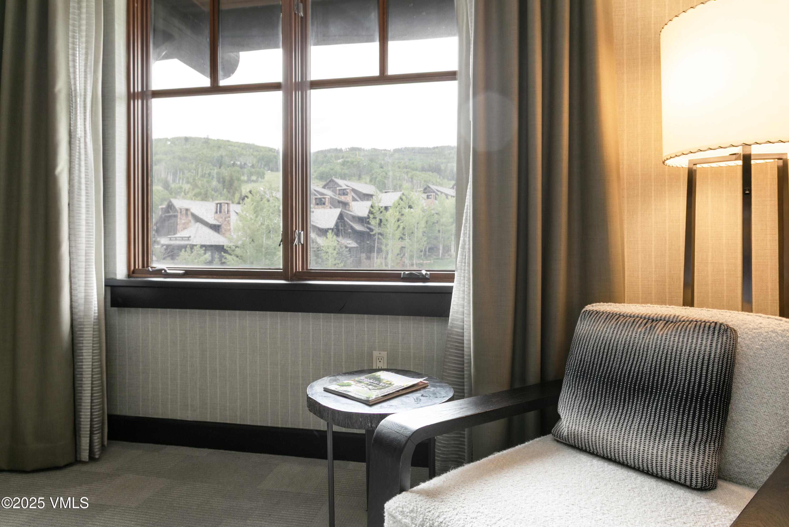 130 Daybreak Ridge Road, Unit 732 Avon, CO 81620 - Photo 12 of 17 a living room with furniture and a window