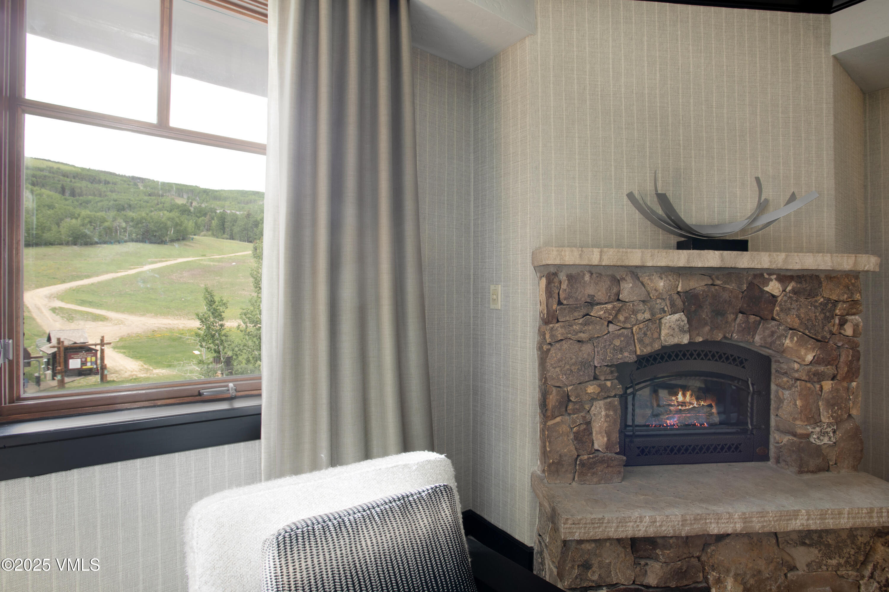 130 Daybreak Ridge Road, Unit 732 Avon, CO 81620 - Photo 8 of 17 a living room with a fireplace