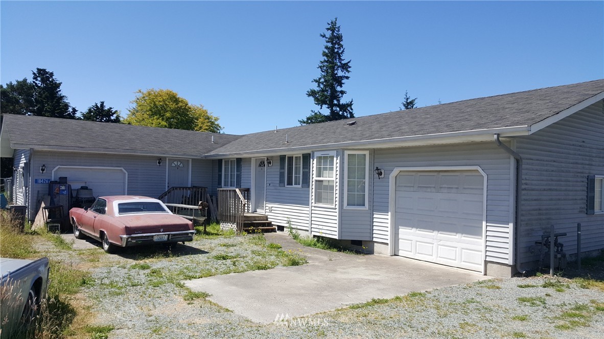 18426 State Rte 20 Burlington, WA 98233 - Photo 1 of 1 a front view of a house with a yard and garage