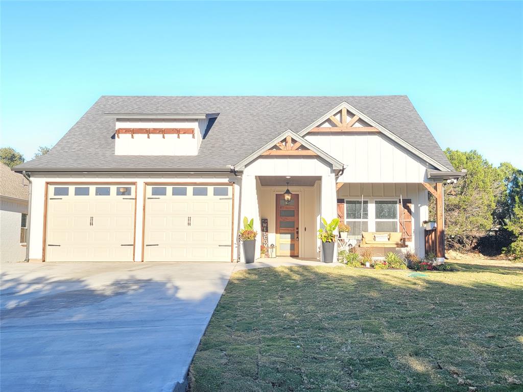 4825 Wichita Street Granbury, TX 76048 - Photo 2 of 30 a view of a house with a swimming pool