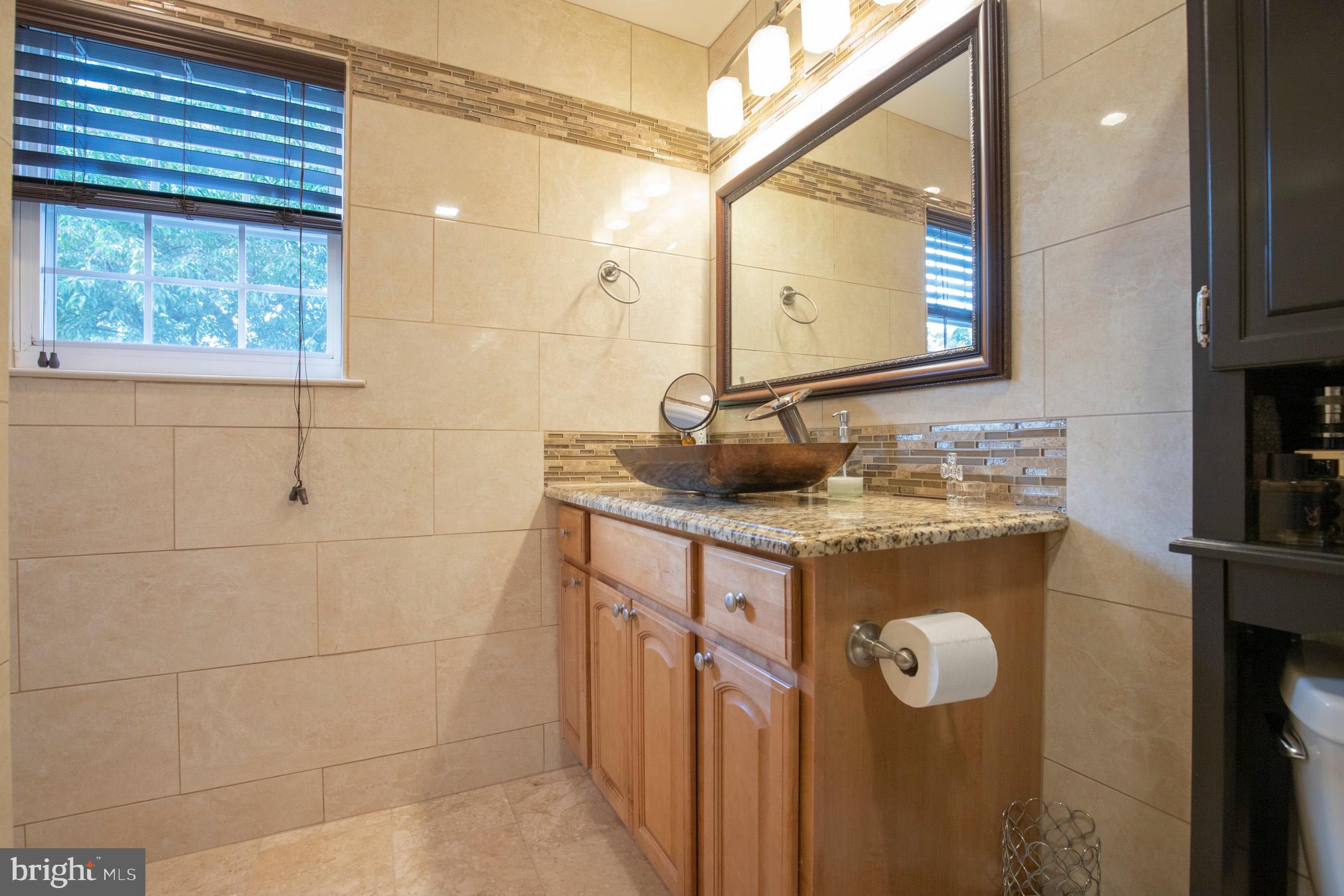 213 Water Street Ridley Park, PA 19078 - Photo 20 of 49 Custom bathroom, vessel sink, tile floor.