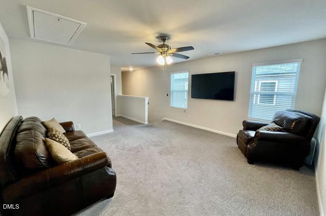 1807 Wrenn Road Durham, NC 27703 - Photo 6 of 43 a living room with furniture and a flat screen tv
