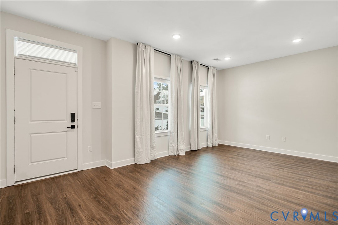 8601 Forge Gate Lane Chesterfield, VA 23832 - Photo 11 of 42 a view of an empty room with wooden floor