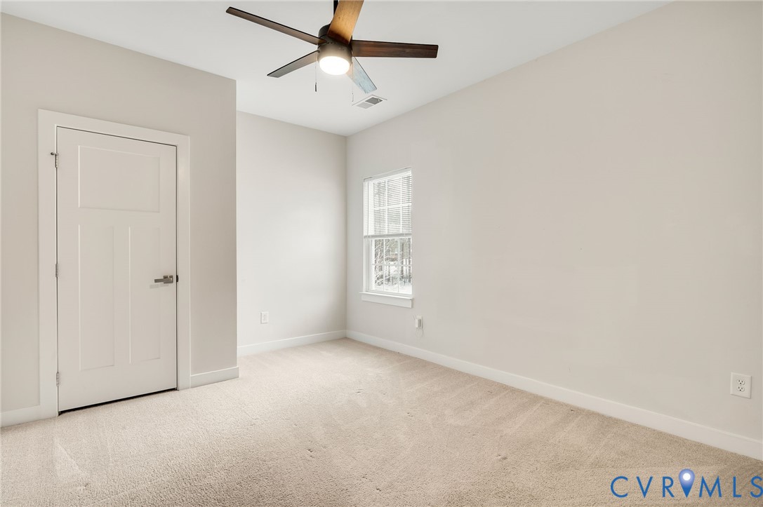 8601 Forge Gate Lane Chesterfield, VA 23832 - Photo 14 of 37 an empty room with a window and a fan