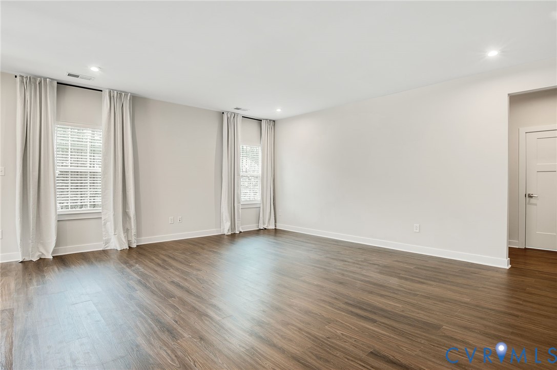 8601 Forge Gate Lane Chesterfield, VA 23832 - Photo 20 of 42 a view of an empty room with wooden floor and a window