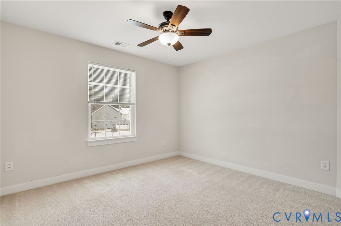 8601 Forge Gate Lane Chesterfield, VA 23832 - Photo 34 of 42 an empty room with windows and fan