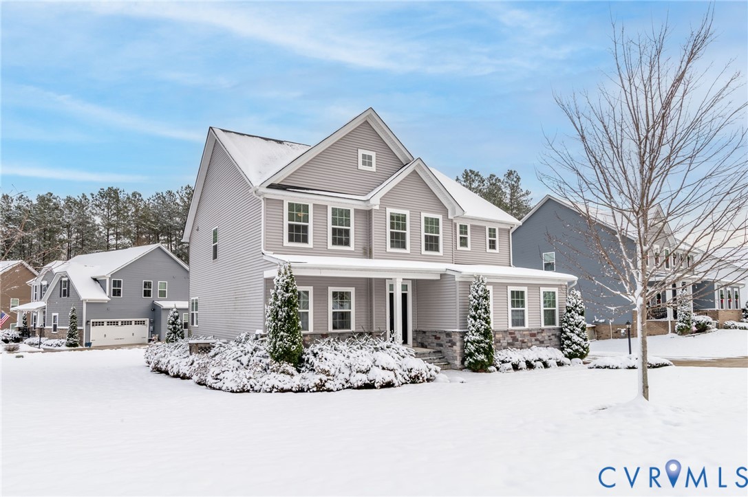 8601 Forge Gate Lane Chesterfield, VA 23832 - Photo 36 of 37 a view of a white house with a yard covered in snow