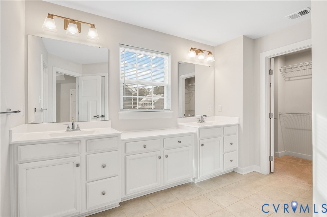 8601 Forge Gate Lane Chesterfield, VA 23832 - Photo 38 of 42 a spacious bathroom with double sink and a mirror