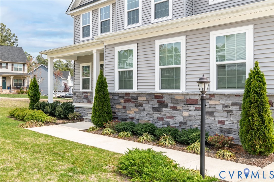 8601 Forge Gate Lane Chesterfield, VA 23832 - Photo 5 of 42 a front view of a house with garden