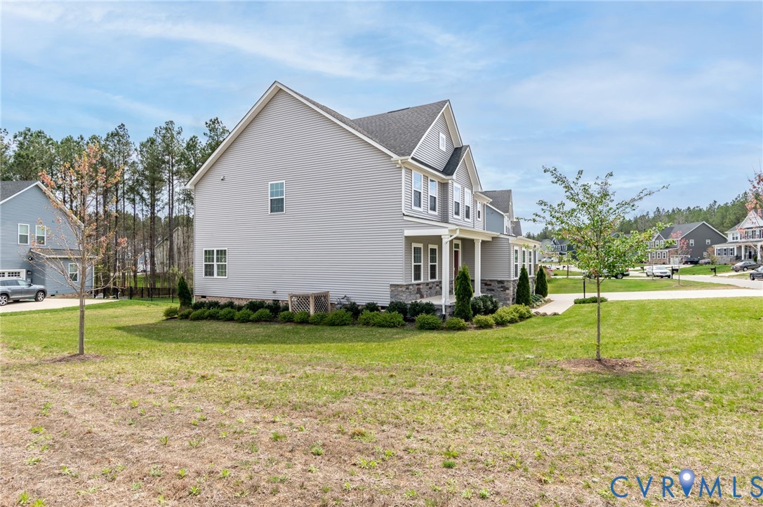 8601 Forge Gate Lane Chesterfield, VA 23832 - Photo 7 of 42 a view of a house with a yard and sitting area