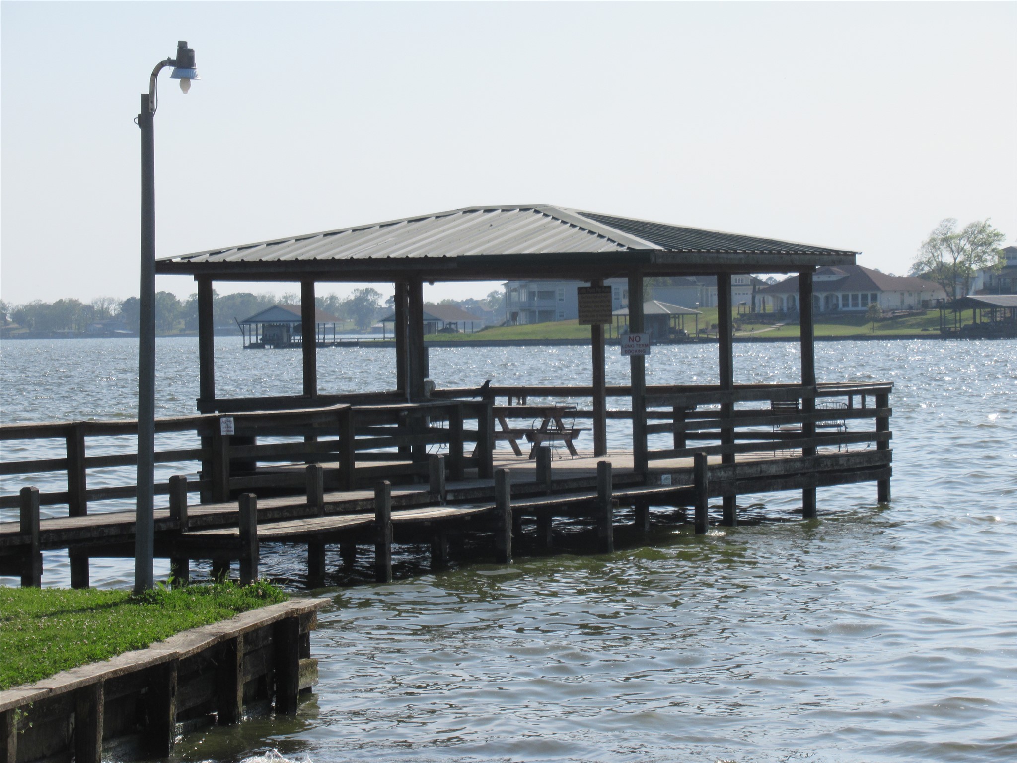 a backyard of a house with barbeque oven