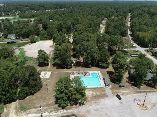 a view of a park with large trees