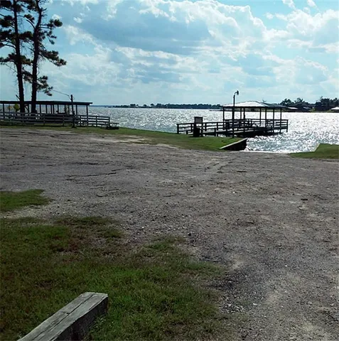 an aerial view of a house with a lake view