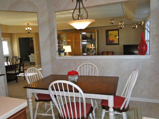 13384 Delaney Road Huntley, IL 60142 - Photo 11 of 16 a view of a dining room with furniture and wooden floor