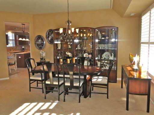 13384 Delaney Road Huntley, IL 60142 - Photo 6 of 16 a view of a dining room with furniture and chandelier