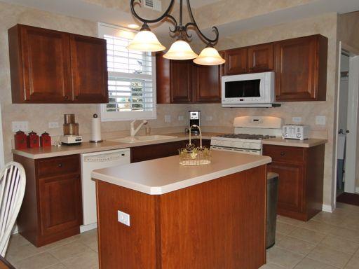 13384 Delaney Road Huntley, IL 60142 - Photo 10 of 16 a kitchen with stainless steel appliances a sink a microwave and cabinets